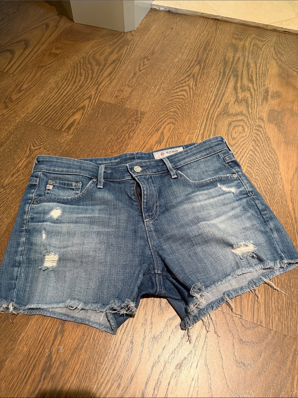 AG Adriano Goldschmied Distressed Blue Denim Cutoff Shorts